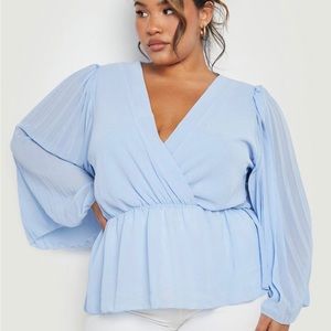 Light blue, peplum top. Brand Boohoo and size 24